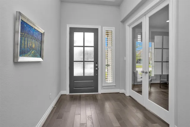 a work room with furniture and a flat screen tv