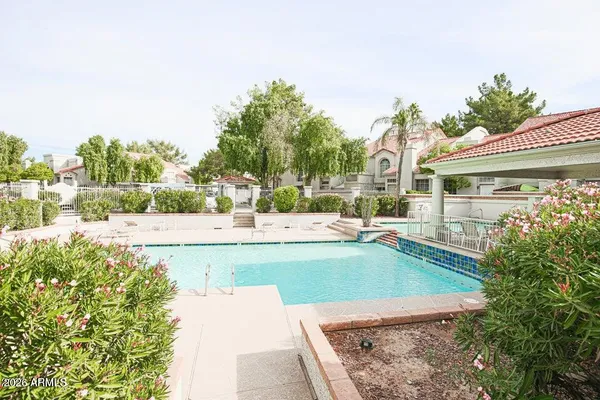 a view of a swimming pool with a patio