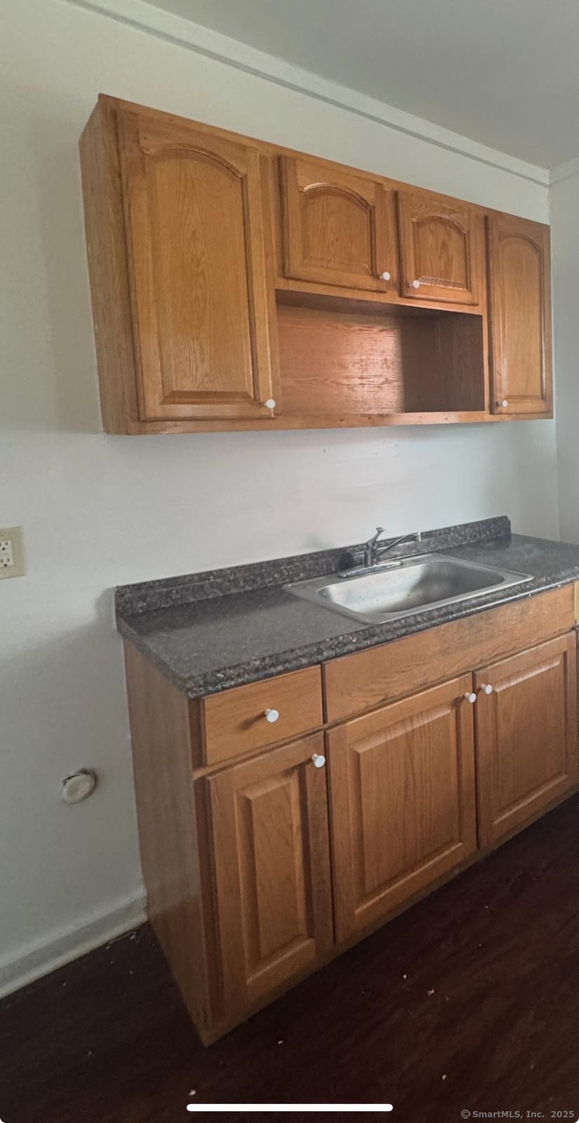 202 Noble Avenue, Unit 3 Bridgeport, CT 06608 - Photo 5 of 6 a kitchen with granite countertop cabinets stainless steel appliances and a sink