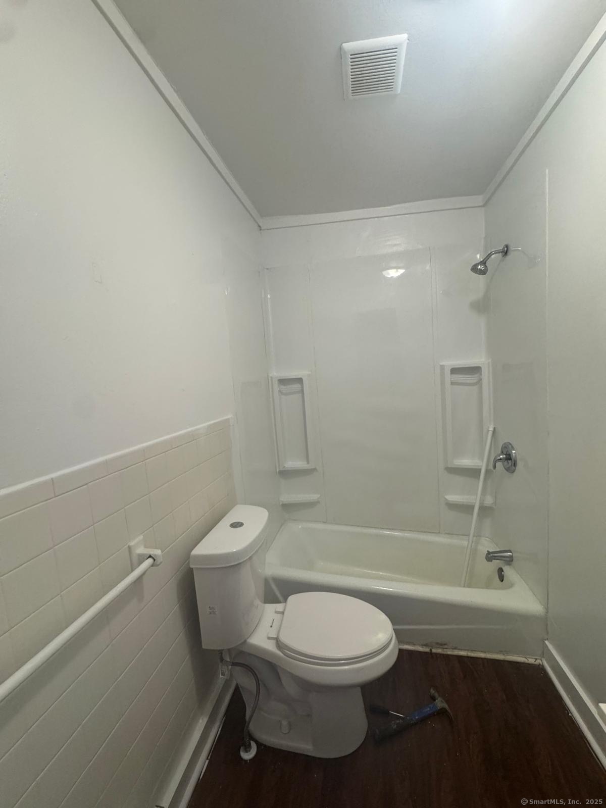 202 Noble Avenue, Unit 3 Bridgeport, CT 06608 - Photo 6 of 6 a bathroom with a toilet and a shower