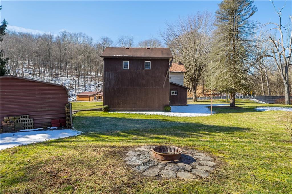69 Pike Run Road Daisytown, PA 15427 - Photo 11 of 39 a view of a house with a swimming pool