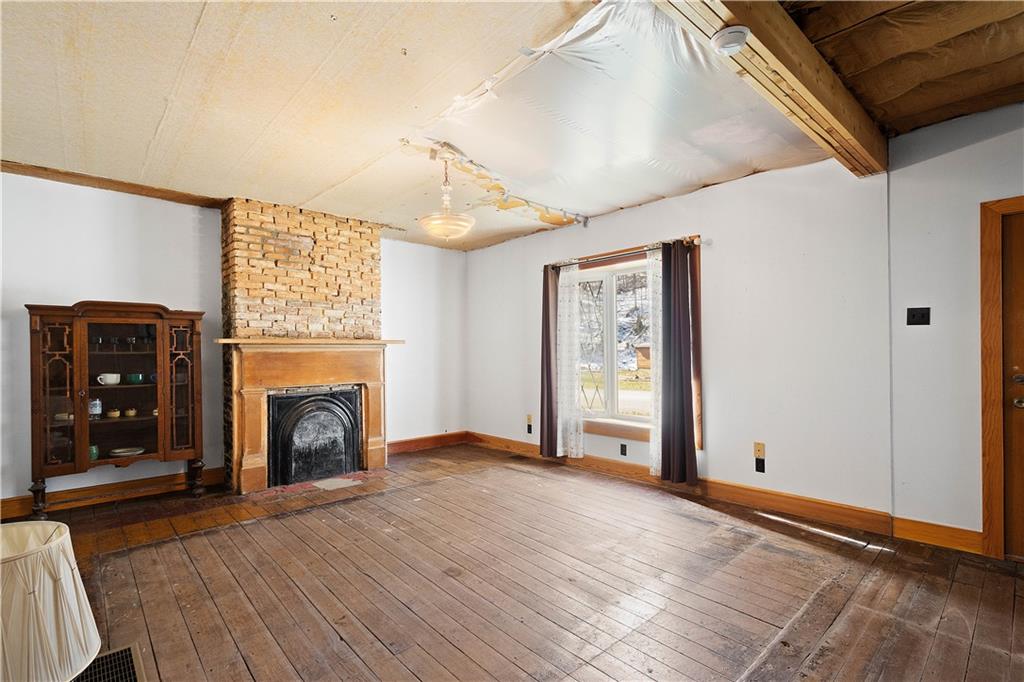 69 Pike Run Road Daisytown, PA 15427 - Photo 19 of 39 a view of an empty room with window and fireplace