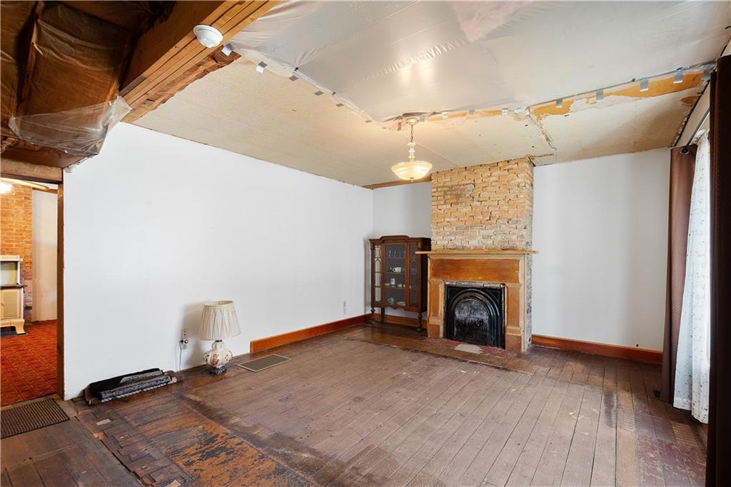 69 Pike Run Road Daisytown, PA 15427 - Photo 21 of 39 a view of an empty room with window and fireplace