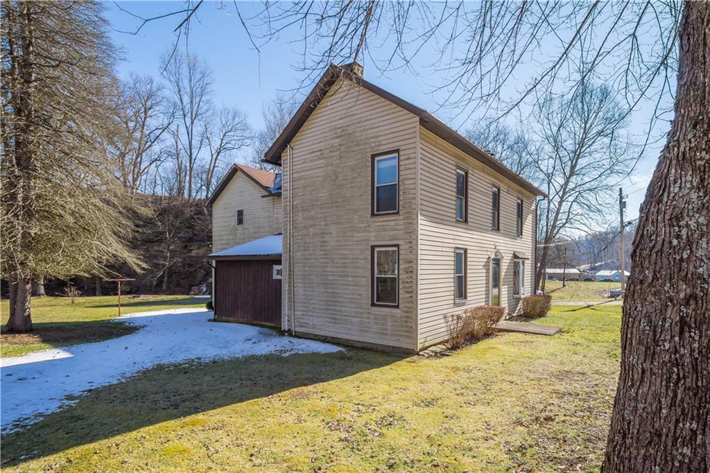 69 Pike Run Road Daisytown, PA 15427 - Photo 4 of 39 a front view of a house with a yard