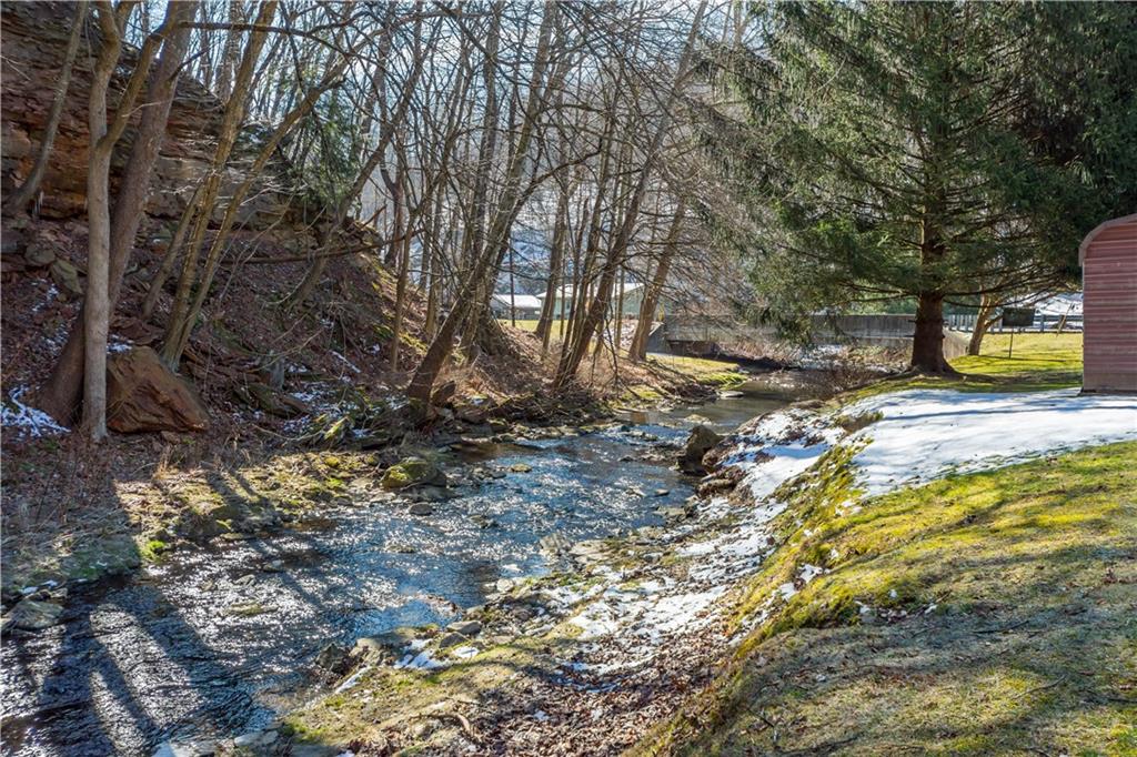 69 Pike Run Road Daisytown, PA 15427 - Photo 9 of 39 a view of a backyard with swimming pool