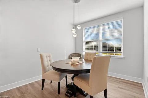 a bedroom with a bed a table and chair