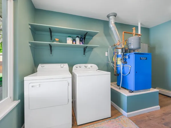 a white toilet sitting next to a bathroom sink