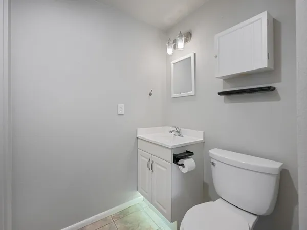an empty room with a empty space and windows