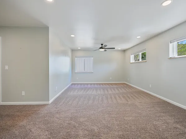 a view of an empty room with a window
