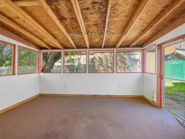 a view of backyard with a garden and garage