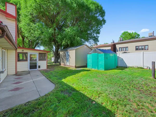 a view of a backyard with a garden and plants