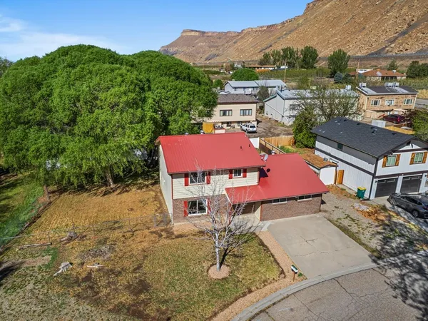 an aerial view of a house with a lake view