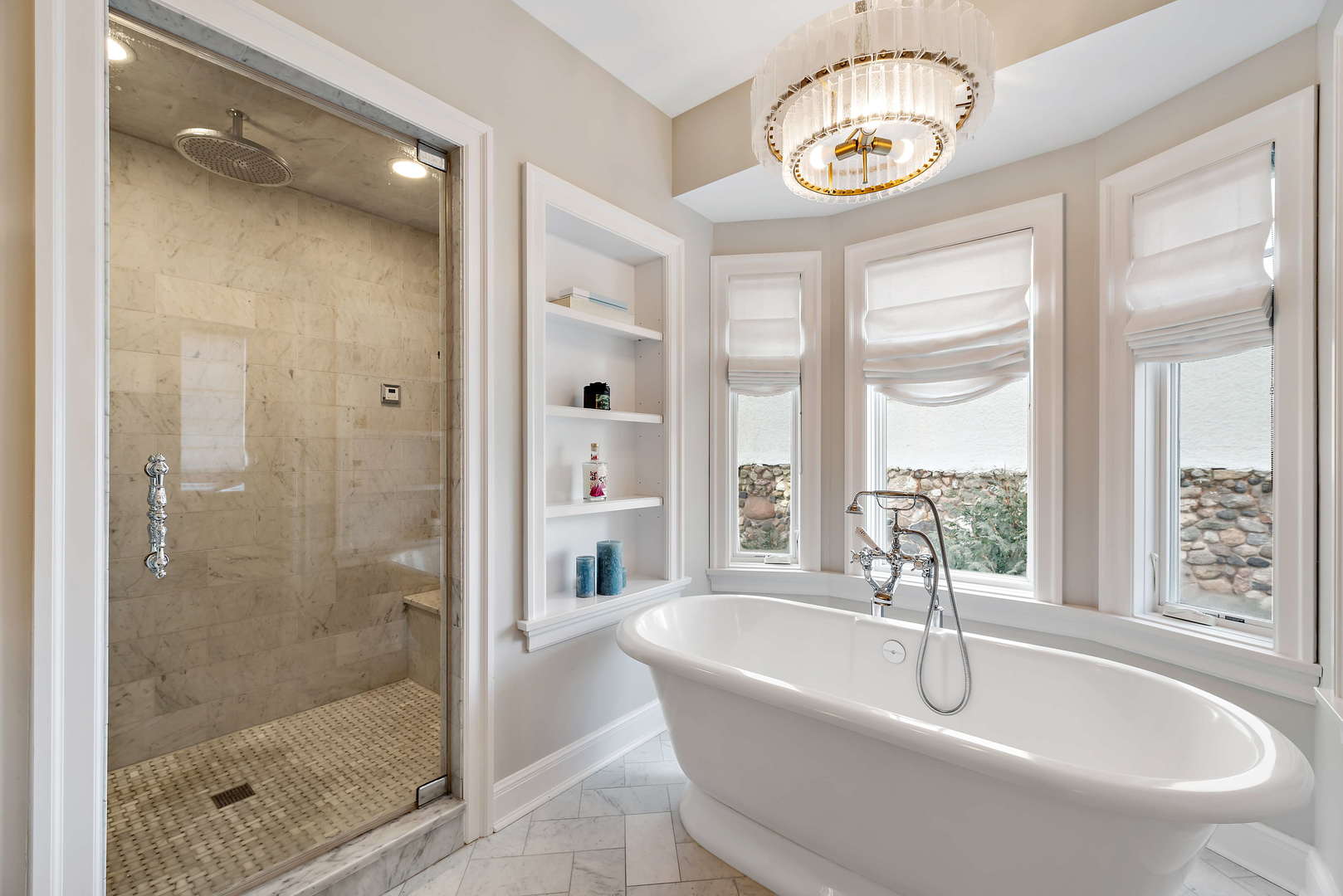 Undisclosed Address Winnetka, IL 60093 - Photo 21 of 41 a bathroom with a granite countertop sink a mirror and a bathtub