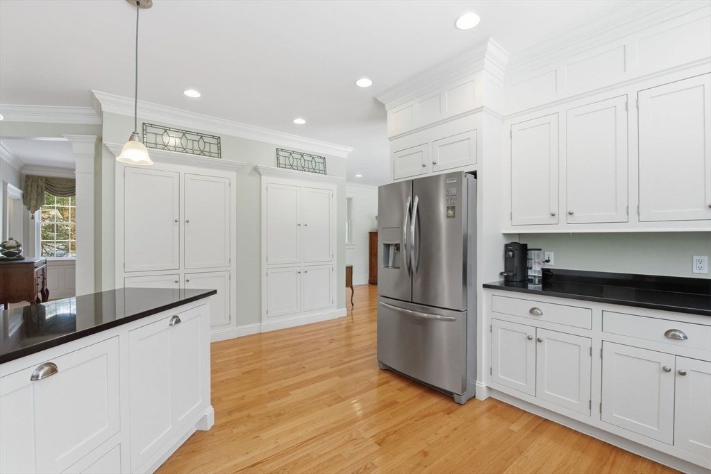 16 Hawthorn Road Amherst, MA 01002 - Photo 11 of 42 a kitchen with granite countertop a refrigerator and a sink