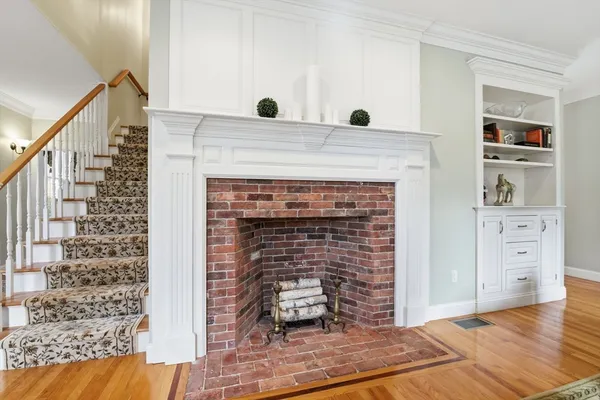 a view of living room with furniture and fireplace