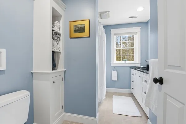 a bathroom with a toilet sink and tub