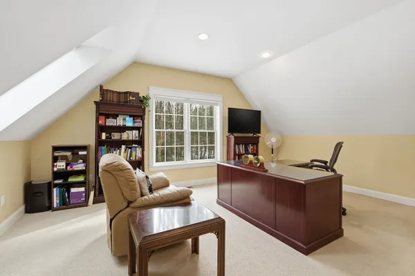 a view of a workspace with furniture