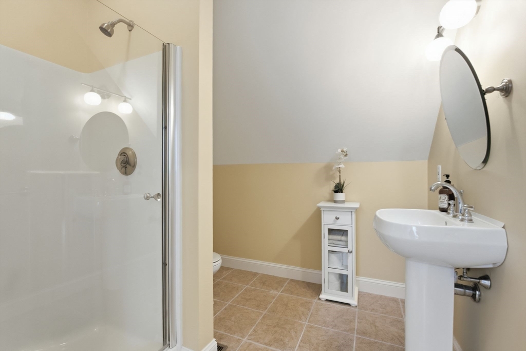 16 Hawthorn Road Amherst, MA 01002 - Photo 36 of 42 a bathroom with a sink a shower and a mirror
