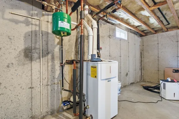 a view of a bathroom with a shower and chair