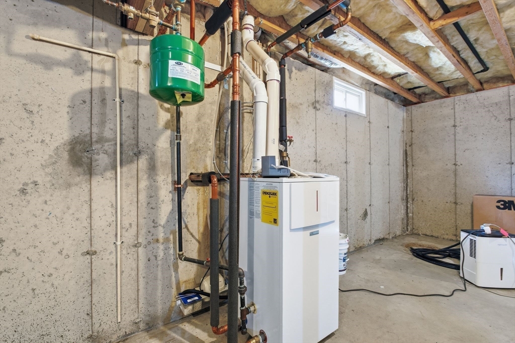 16 Hawthorn Road Amherst, MA 01002 - Photo 40 of 42 a view of a bathroom with a shower and chair