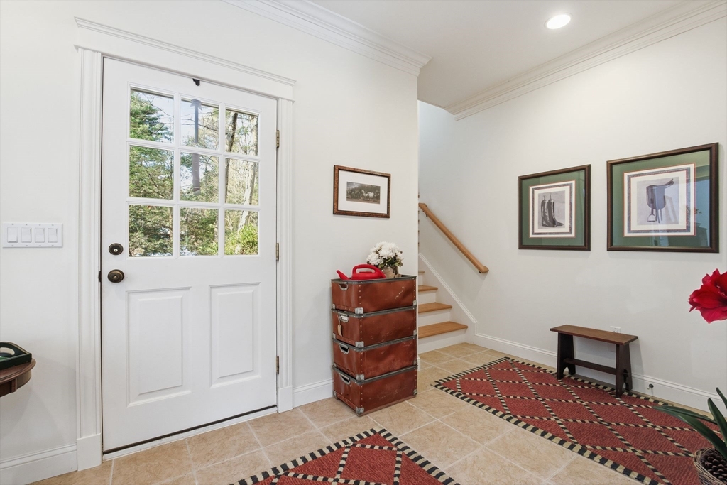 16 Hawthorn Road Amherst, MA 01002 - Photo 6 of 42 a view of a livingroom with stairs and a workspace