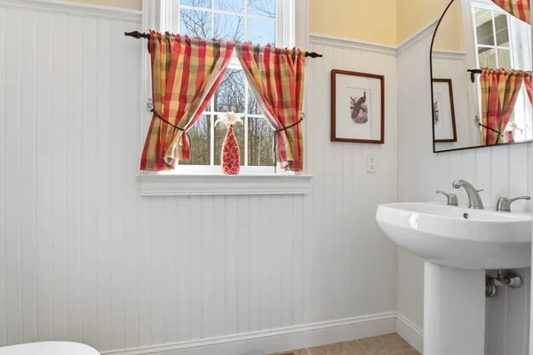 a bathroom with a sink and a window
