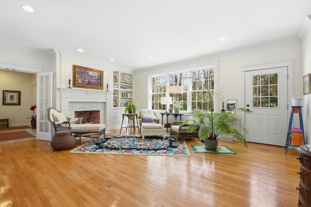 16 Hawthorn Road Amherst, MA 01002 - Photo 8 of 42 a living room with furniture large window and a fireplace
