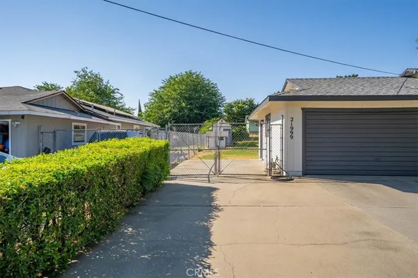 a view of a house with backyard and swimming pool