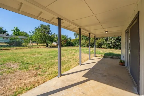 a view of a room with a big yard