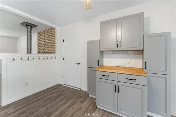 a view of cabinets with wooden floor
