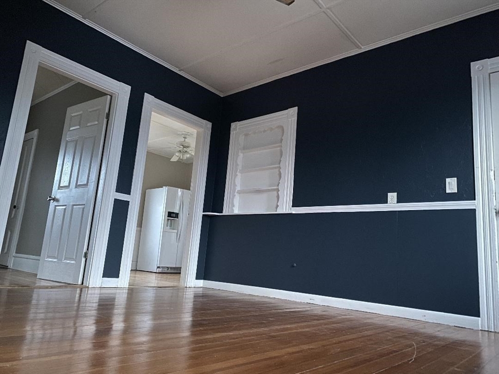 147 Stetson Street, Unit 2 Fall River, MA 02720 - Photo 2 of 8 a view of a hallway with wooden floor