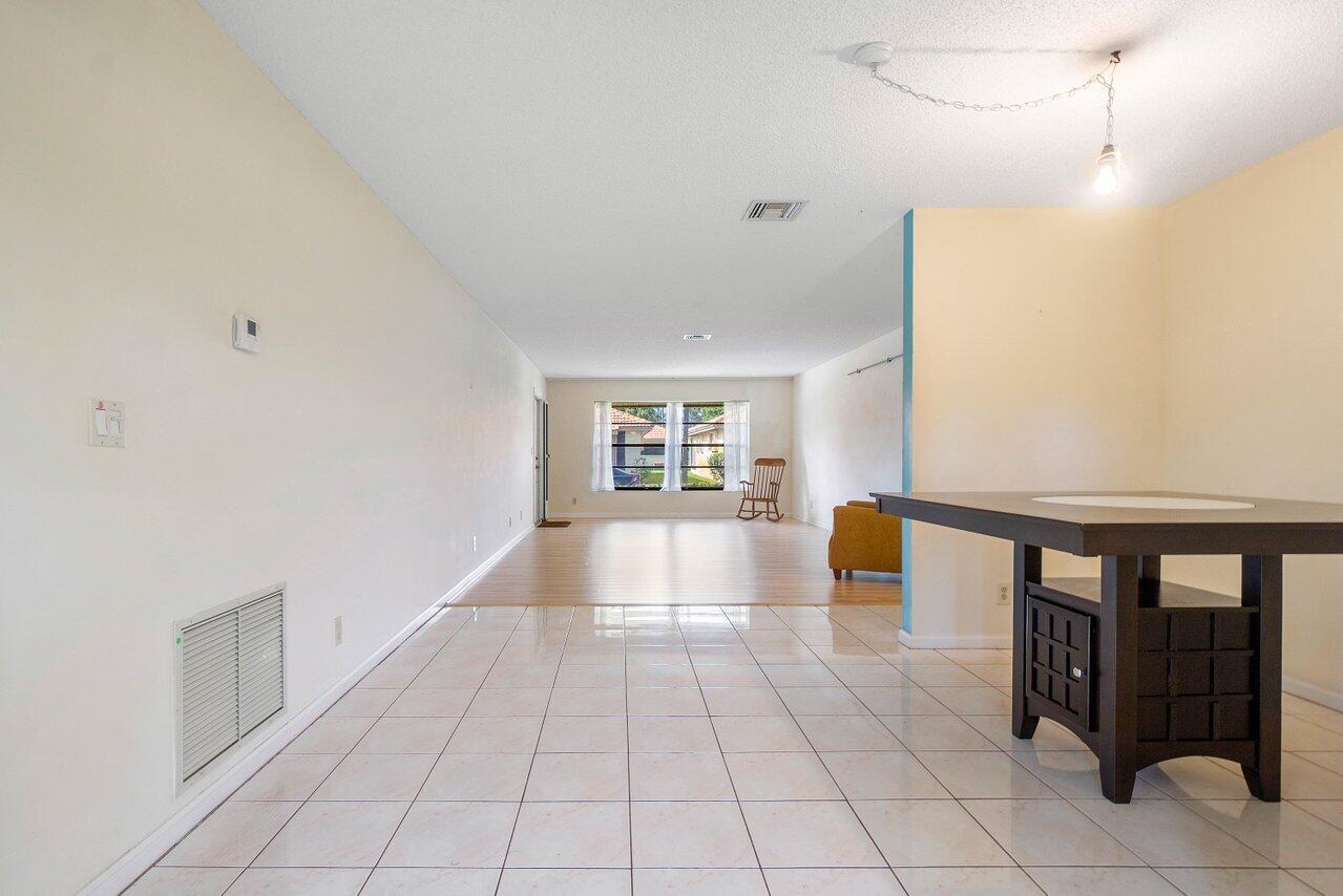 4495 Pandanus Tree Road, Unit A Boynton Beach, FL 33436 - Photo 11 of 32 Dining Room to Living Room