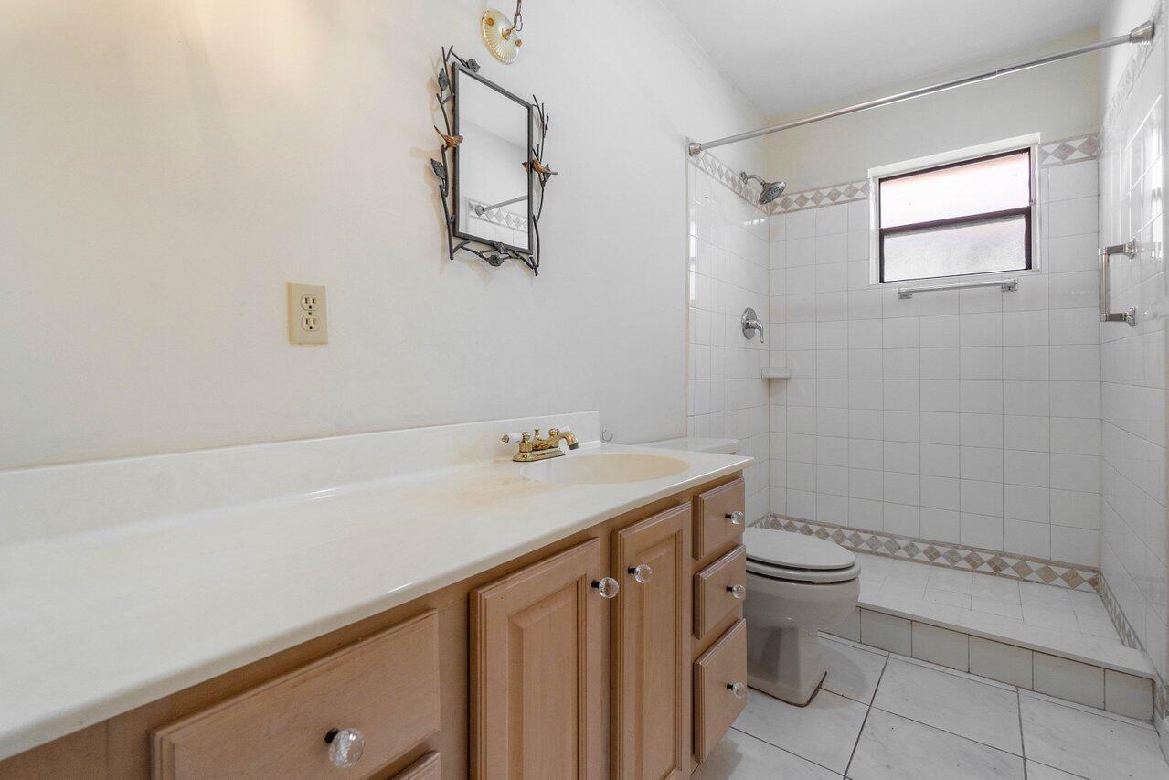 4495 Pandanus Tree Road, Unit A Boynton Beach, FL 33436 - Photo 18 of 32 Guest Bathroom