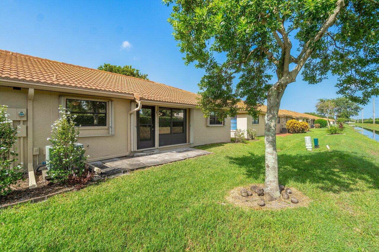 4495 Pandanus Tree Road, Unit A Boynton Beach, FL 33436 - Photo 20 of 32 Back of Villa