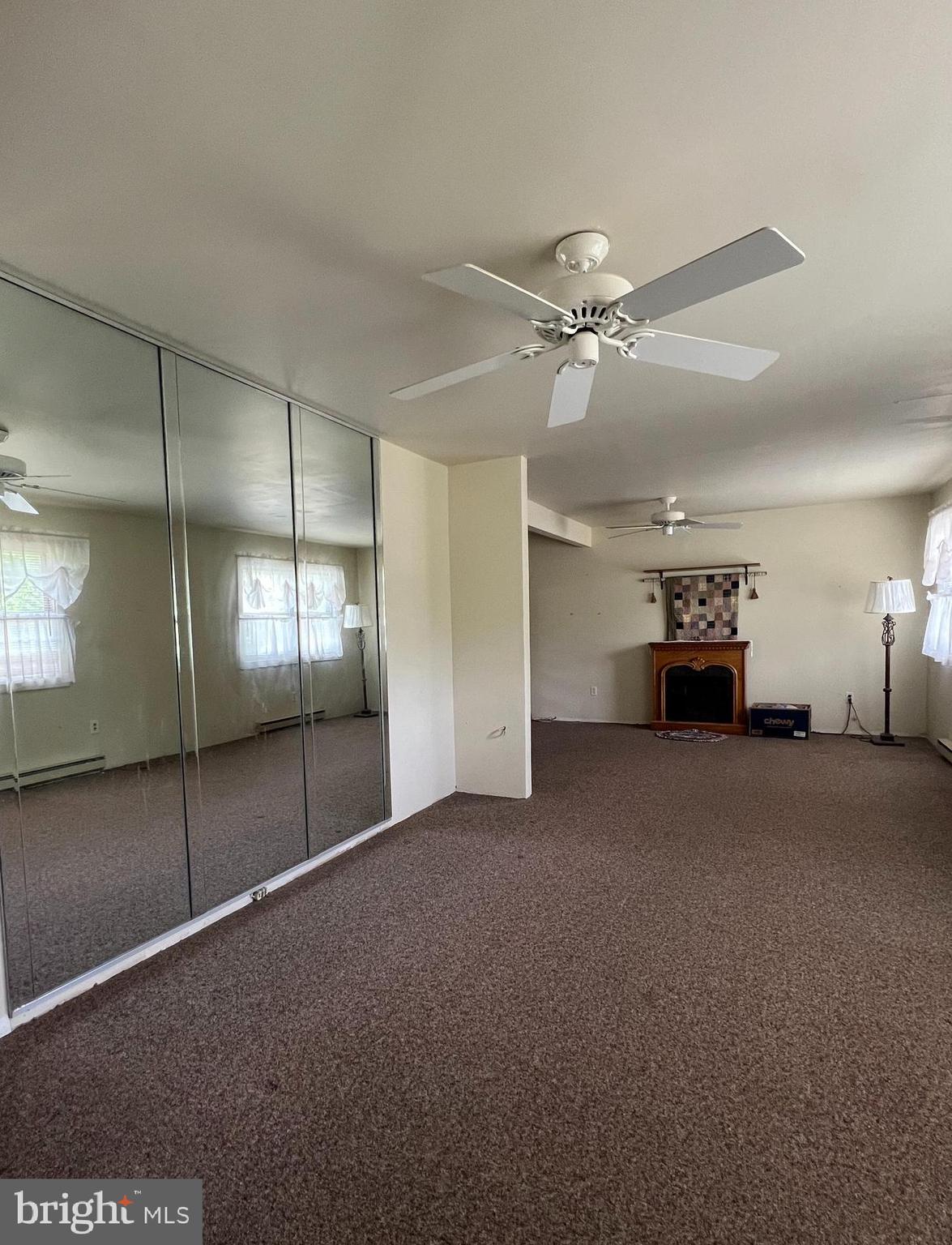 707 Upper Neck Road Pittsgrove, NJ 08318 - Photo 2 of 14 a view of empty room with a ceiling fan and window