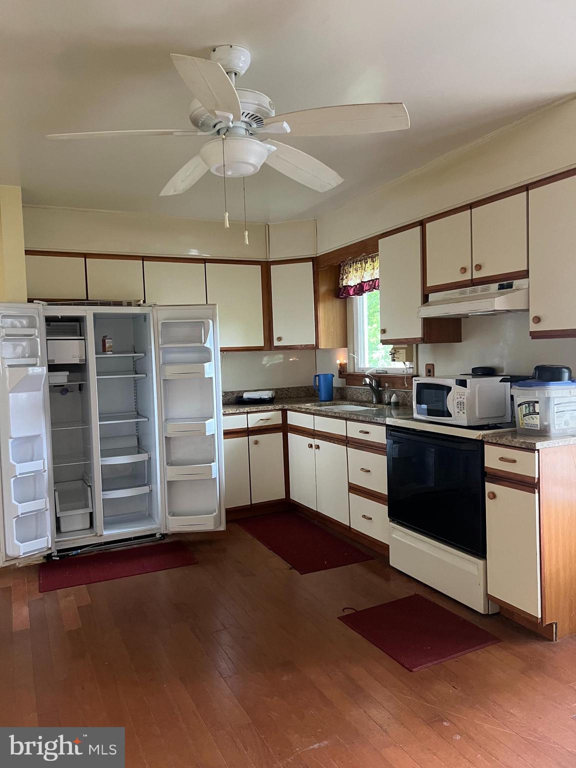 707 Upper Neck Road Pittsgrove, NJ 08318 - Photo 4 of 14 a kitchen with granite countertop a refrigerator oven a sink and dishwasher