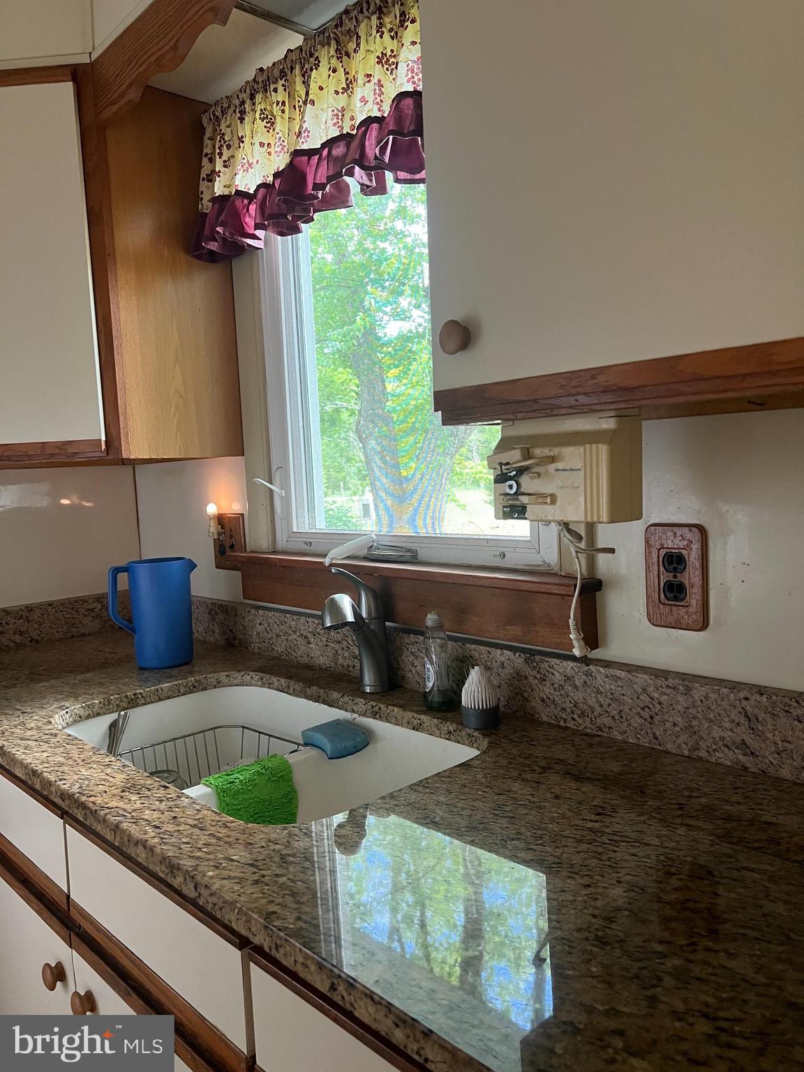 707 Upper Neck Road Pittsgrove, NJ 08318 - Photo 5 of 14 a kitchen with stainless steel appliances granite countertop a sink a stove and a wooden cabinets