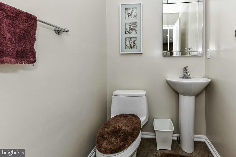 2 Parker Farm Court Silver Spring, MD 20906 - Photo 18 of 34 a bathroom with a toilet sink and mirror