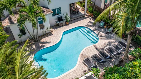 a view of a swimming pool with a garden