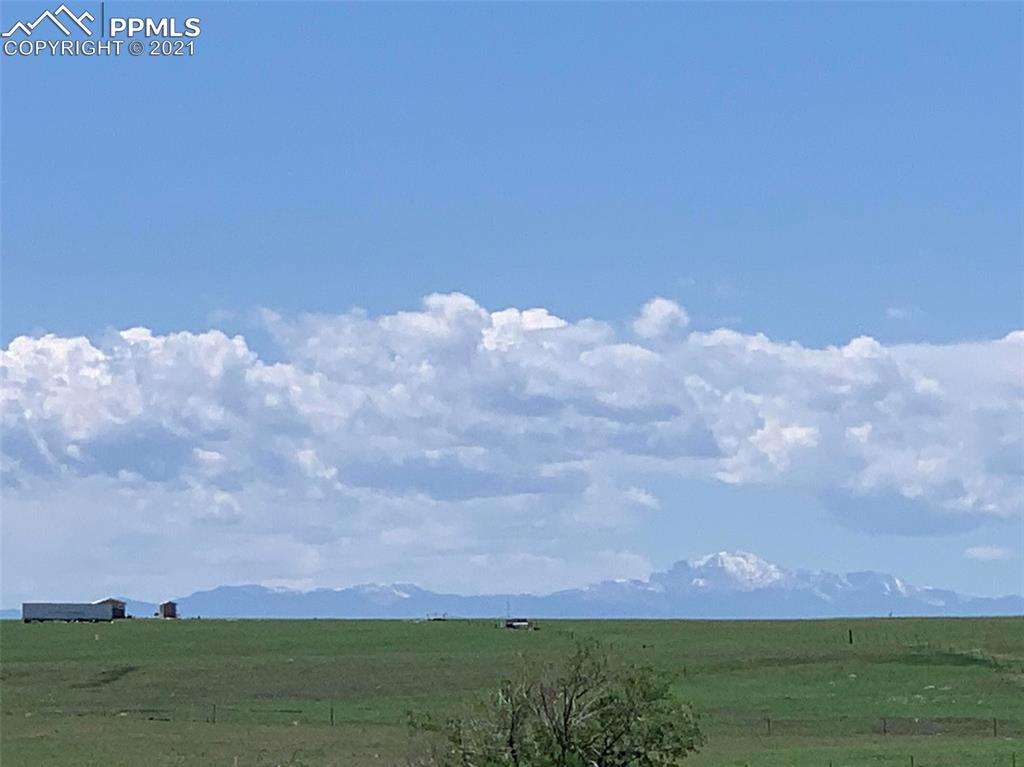 1331 County Road R Rush, CO 80833 - Photo 18 of 22 a view of a lake and a yard
