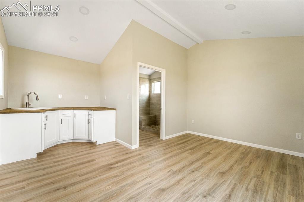 1331 County Road R Rush, CO 80833 - Photo 4 of 22 a view of an empty room with wooden floor and a window