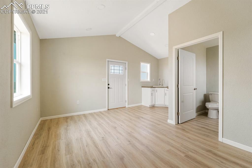 1331 County Road R Rush, CO 80833 - Photo 5 of 22 a view of a room with wooden floor and a sink