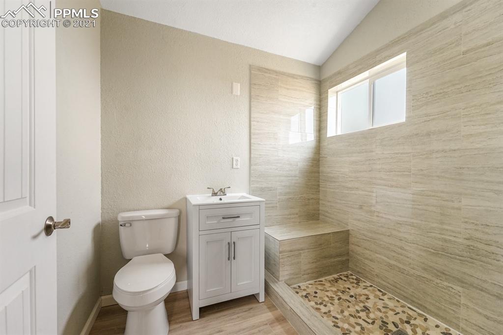 1331 County Road R Rush, CO 80833 - Photo 8 of 22 a bathroom with a toilet sink and window