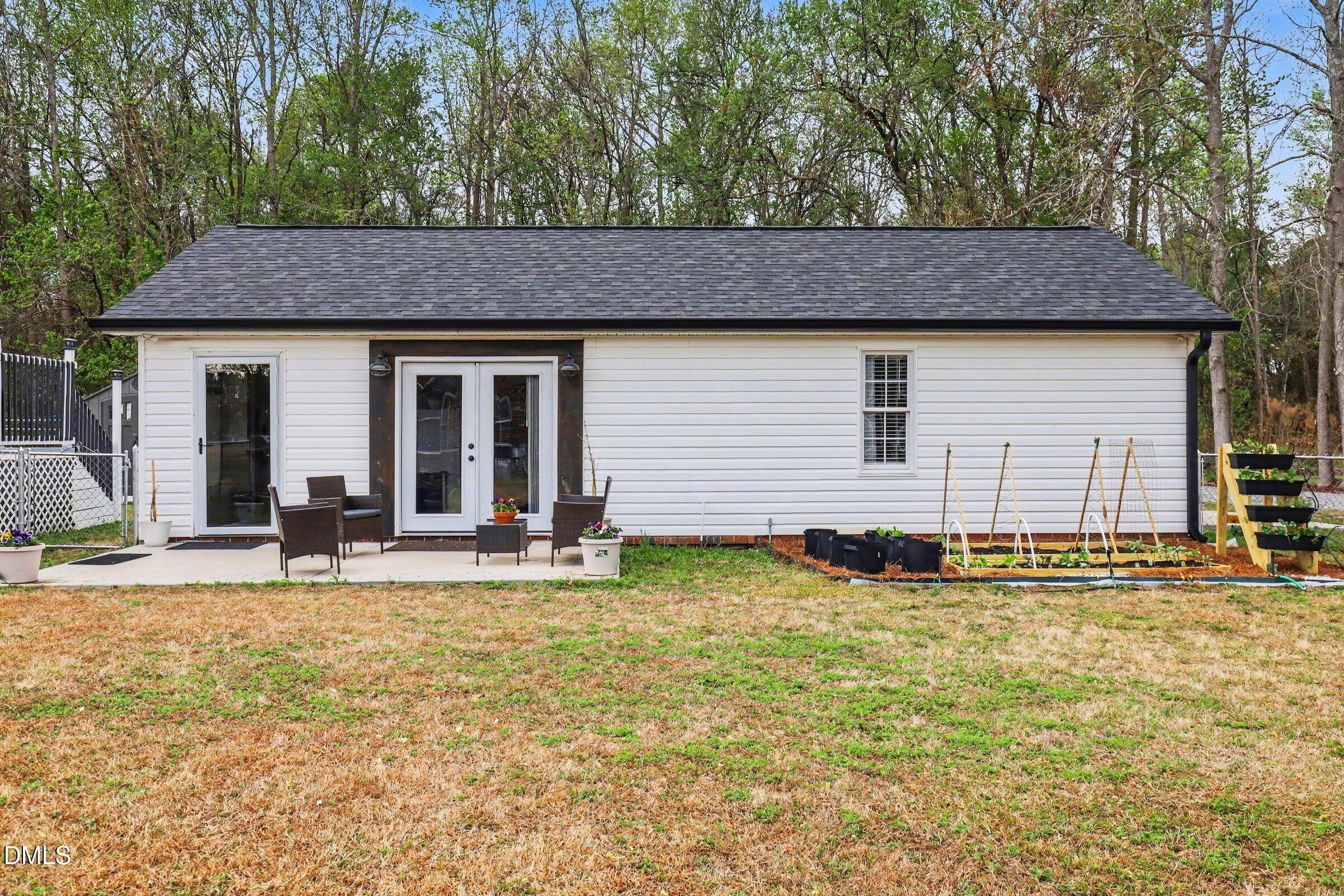 430 Fred Hall Road Stedman, NC 28391 - Photo 44 of 63 a house view with a outdoor seating space
