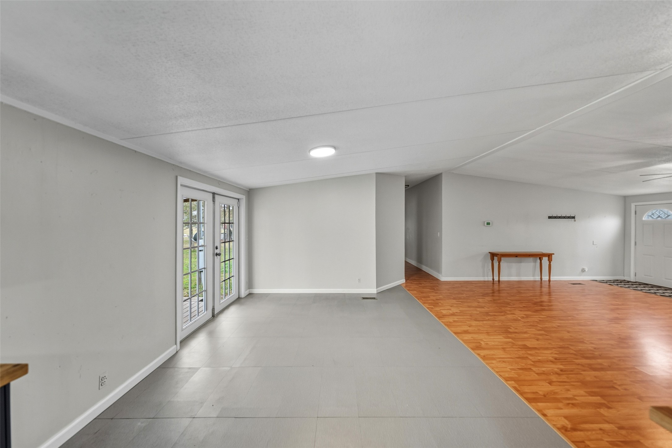 234 County Road 2286 Cleveland, TX 77327 - Photo 10 of 35 Dining area connects to living room and also boasts French doors to the backyard.
