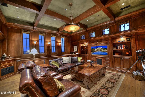 a living room with lots of furniture and a flat screen tv