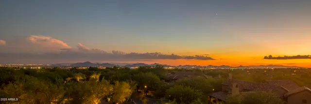 a view of a city with mountains in the background