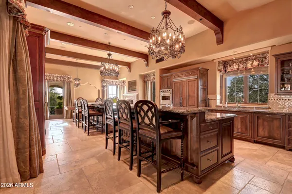 a living room with furniture fireplace and wooden floor