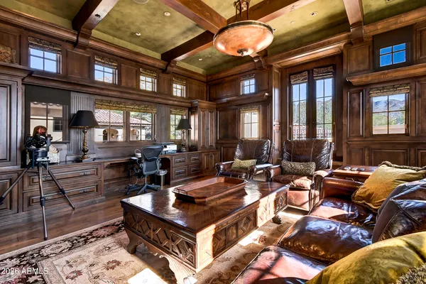 a bathroom with a sink a vanity a mirror and a shower