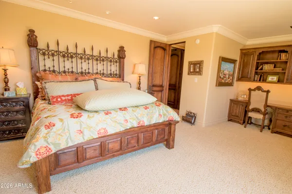 a view of a livingroom with workspace and a window